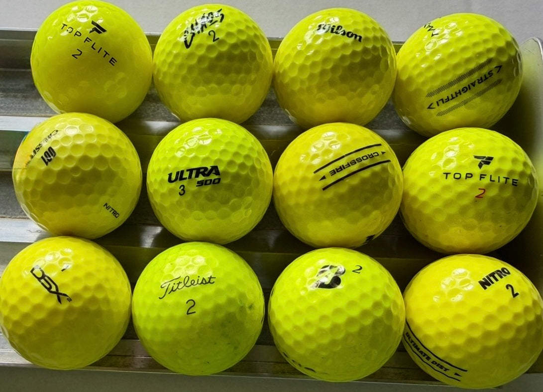 Gelbe Lakeballs verschiedener Marken (TopFlite, Callaway, Wilson) – gebrauchte Golfbälle mit Erfahrung