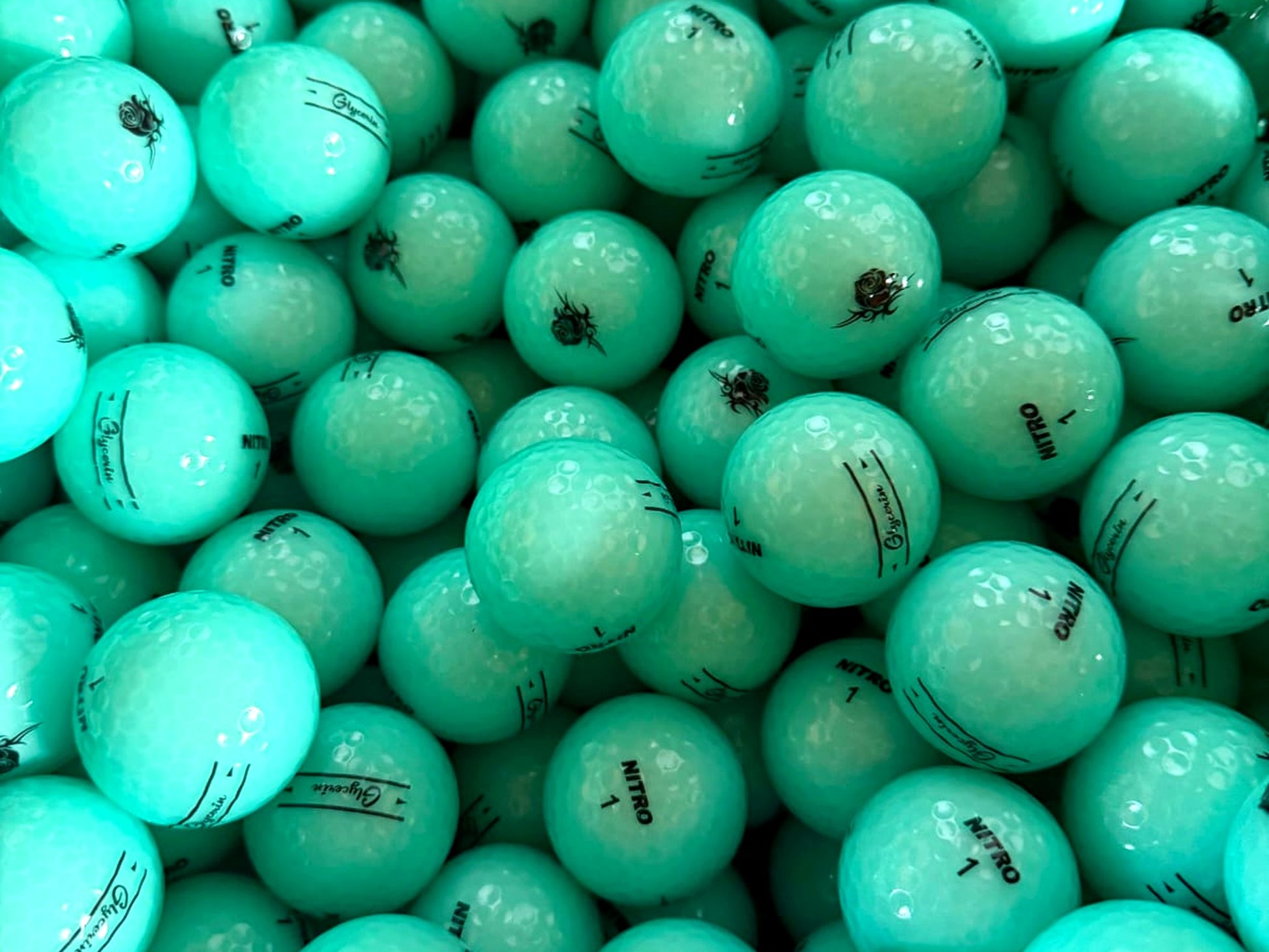 Mintgrüne Golfbälle von Nitro und Glycerin mit Rosen-Print – Türkis Blau Mix von TopBall Schweiz