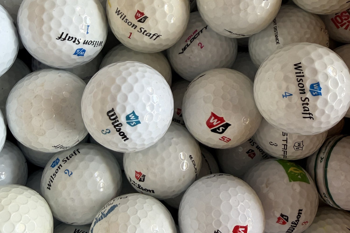 Wilson Staff Mix – gebrauchte Golfbälle mit Erfahrung, Nahaufnahme aus dem TopBall Lager